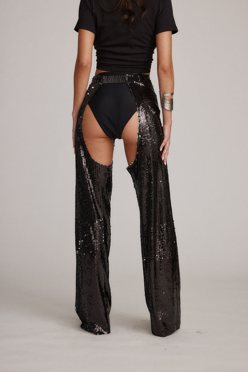 Back view of the black sequin pants showing the silhouette and fit.