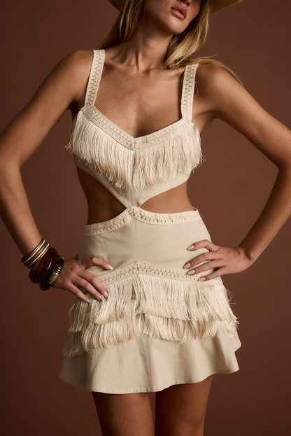 Ivory fringe cutout mini dress with refined accents, a fringe dress essential.