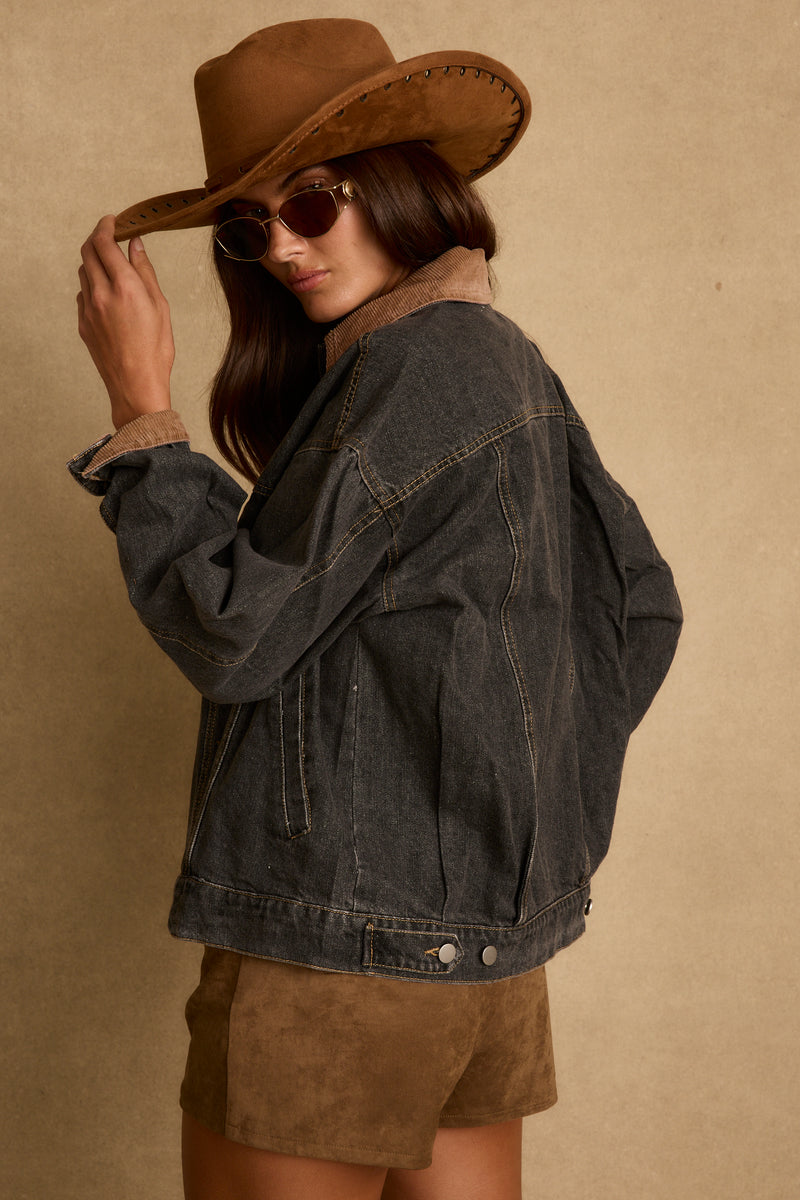 Close-up of the Hayes Washed Black Denim Barn Jacket showcasing the denim texture and craftsmanship.