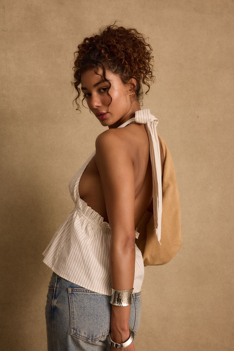 Close-up of the Heda Beige Striped Halter Top showcasing the fabric texture and design details.