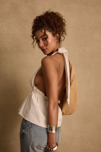 Close-up of the Heda Beige Striped Halter Top showcasing the fabric texture and design details.