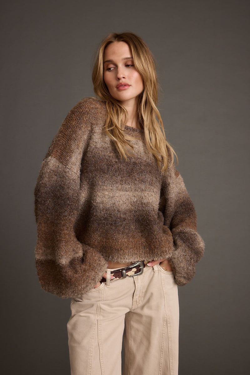 Model wears the Helena ombre balloon sleeve sweater in brown tones with cream jeans.