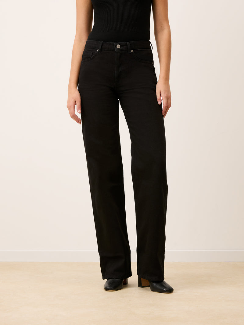 ANVERS rinse black wide-leg jeans worn on a model by Rouje
