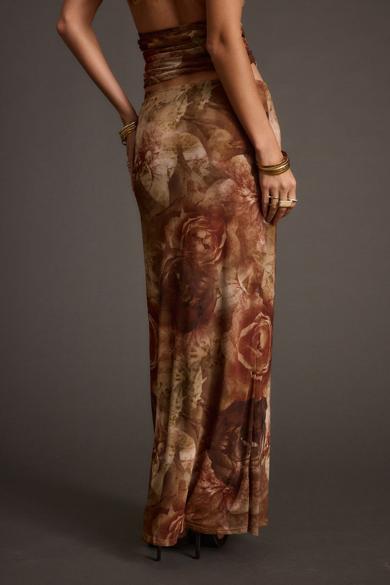 Lifestyle shot of the floral maxi skirt styled for day-to-night versatility.