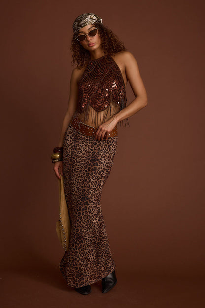Full-length view of the leopard print maxi skirt showing the drape and movement.