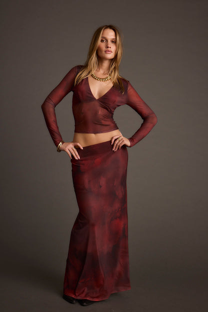 Back view of the mesh maxi skirt showing the silhouette and fit.