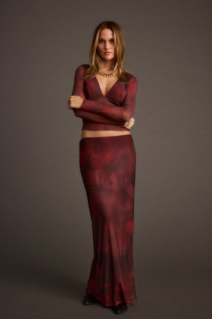 Full-length view of the maxi skirt showing the drape and movement.