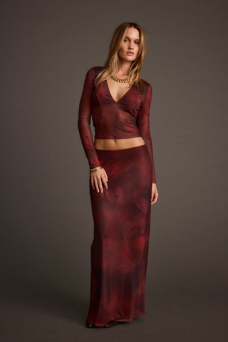 Lifestyle shot of the maxi skirt styled for day-to-night versatility.