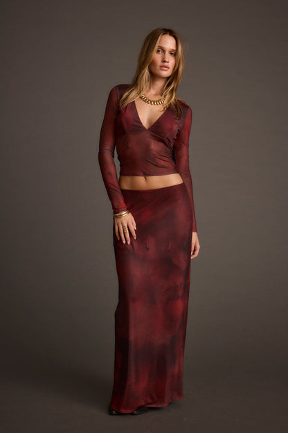 Lifestyle shot of the maxi skirt styled for day-to-night versatility.