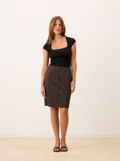 FABIE brown straight midi skirt worn on a model by Rouje