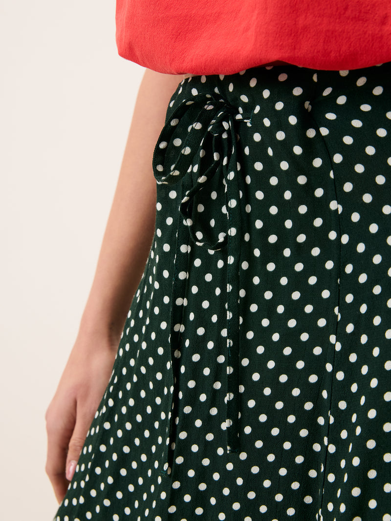 ILONA green polka-dot fluid jersey midi skirt, lifestyle setting by Rouje