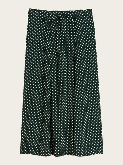 packshot of Ilona midi skirt in green polka dots