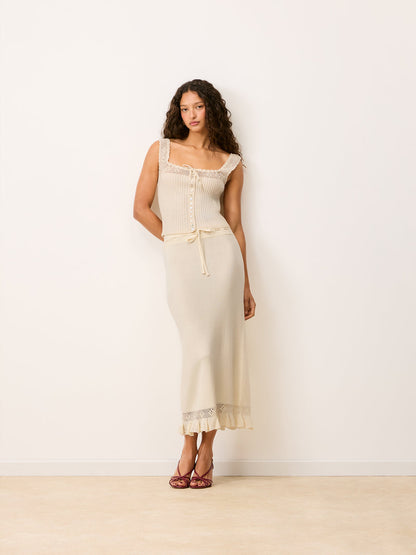 Full look with Lester ecru maxi knit and crochet skirt worn by a model