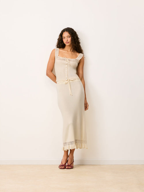 Full look with Lester ecru maxi knit and crochet skirt worn by a model