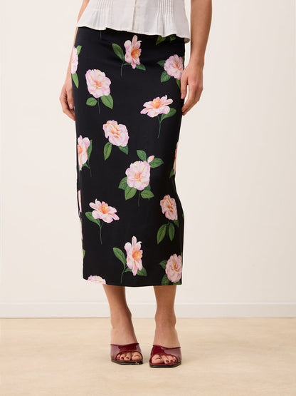 NAELLA black floral satin midi tube skirt, back view by Rouje