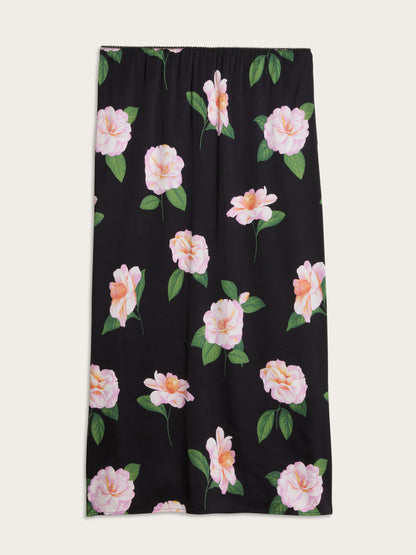 NAELLA black Fleurs de Minuit stretch satin midi skirt, side view by Rouje