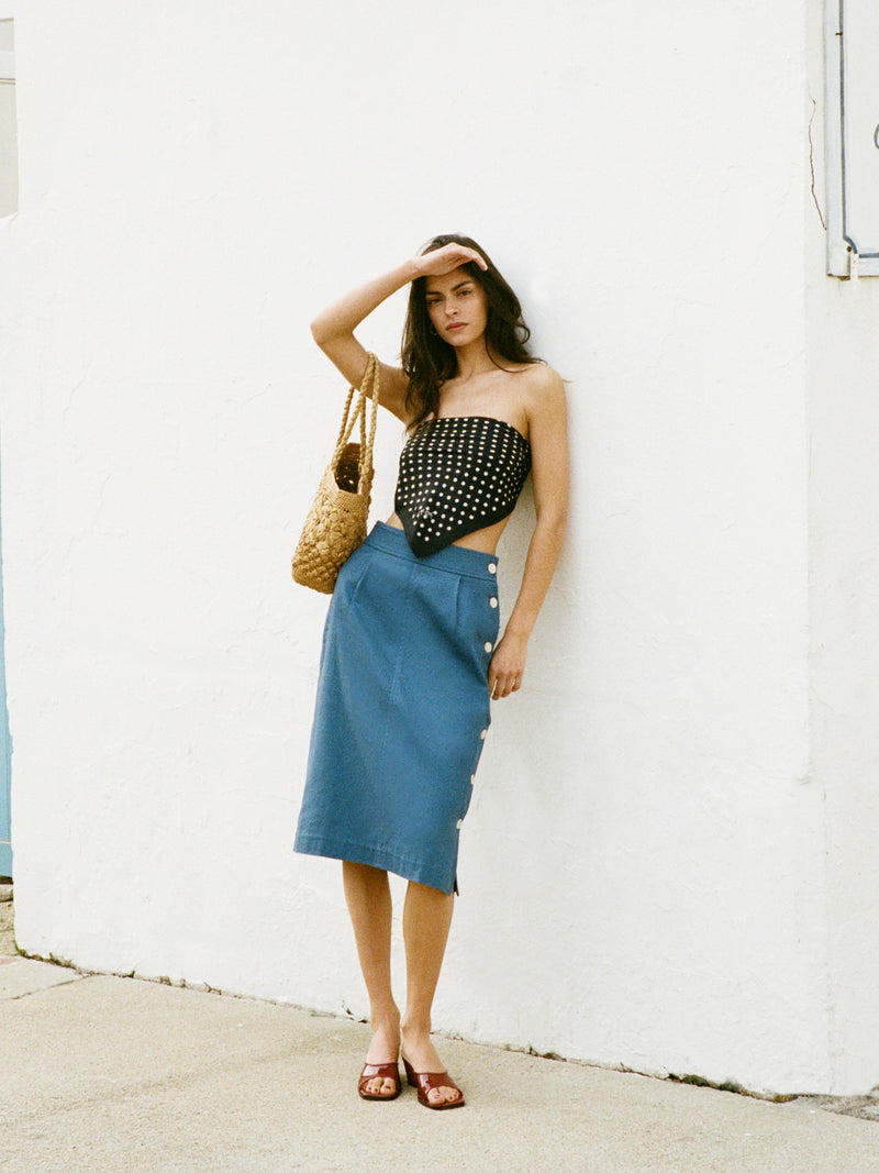 SHERYL denim blue midi skirt worn on a model by Rouje