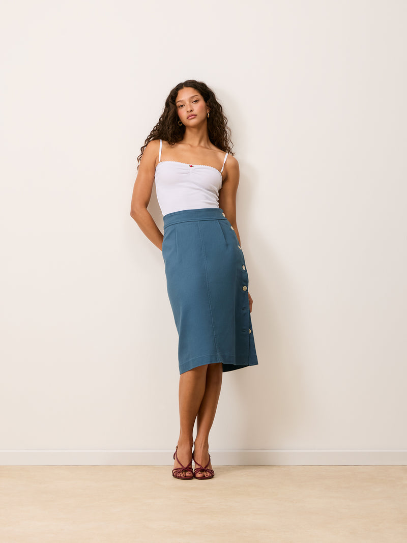 SHERYL denim blue straight buttoned midi skirt, side view by Rouje