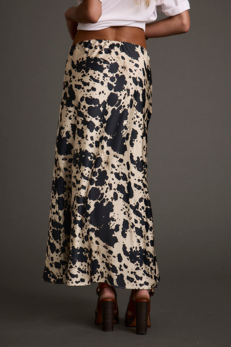 Close-up of the Kacey Cowhide Maxi Skirt showcasing the fabric texture and design details.
