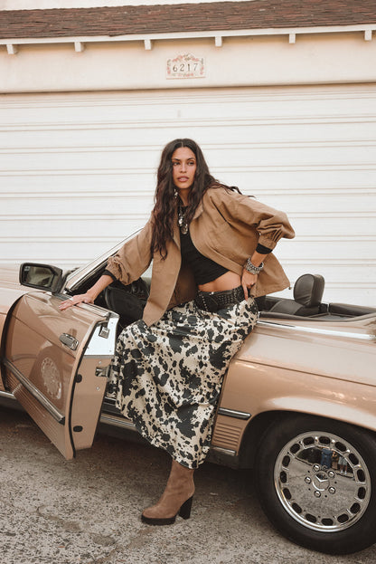 Full-length view of the maxi skirt showing the drape and movement.
