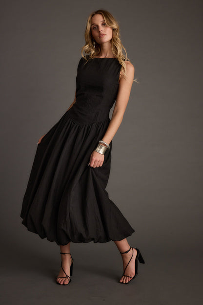 Back view of the black midi dress showing the silhouette and fit.