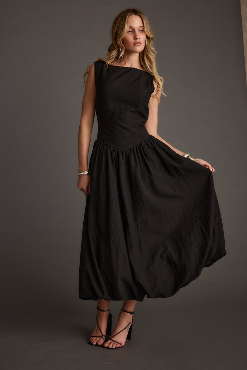 Kate Black Drop Waist Bubble Hem Midi Dress styled in a complete look from an alternate angle.