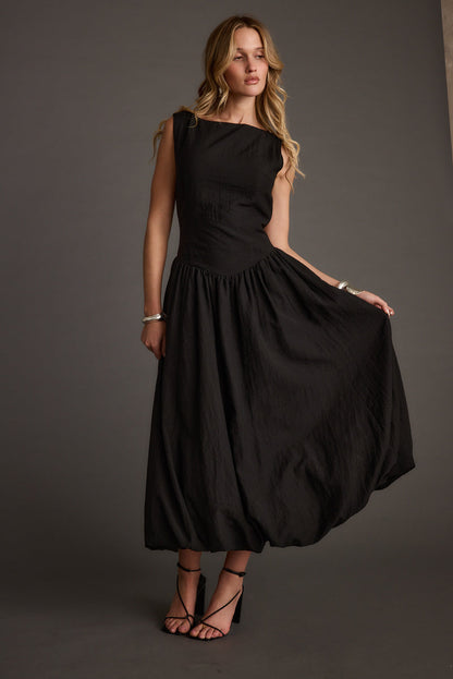 Kate Black Drop Waist Bubble Hem Midi Dress styled in a complete look from an alternate angle.