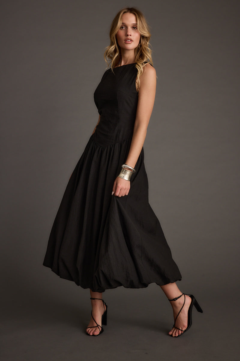 Kate Black Drop Waist Bubble Hem Midi Dress paired with complementary accessories for a polished look.
