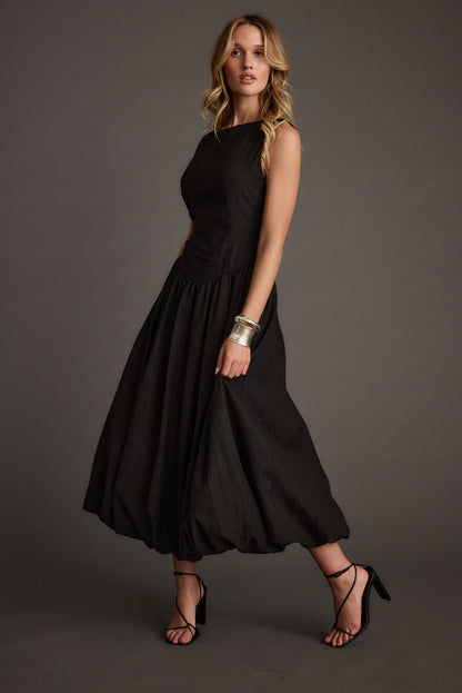 Kate Black Drop Waist Bubble Hem Midi Dress paired with complementary accessories for a polished look.