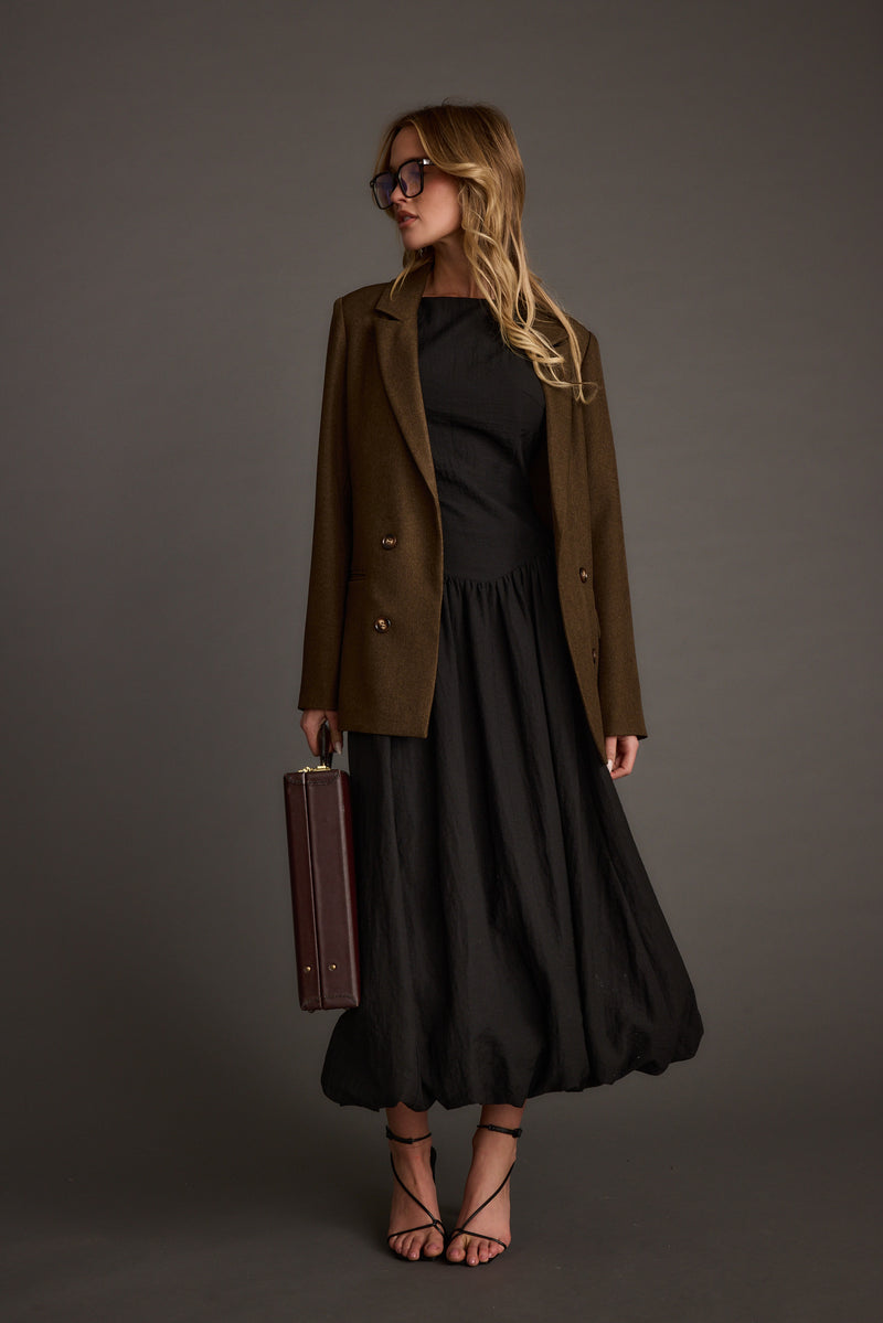 Detail shot of the Kate Black Drop Waist Bubble Hem Midi Dress highlighting the drop-waist elements.