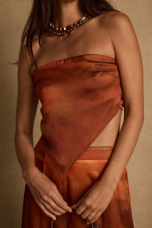 Top with refined detailing and a flattering silhouette.
