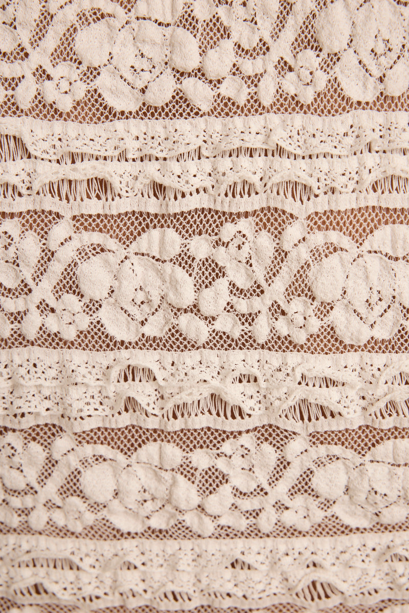 Kristina White Lace Top paired with complementary accessories for a polished look.