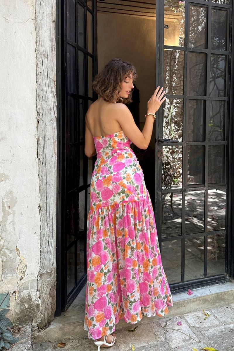 Back view of the pink maxi dress showing the silhouette and fit.