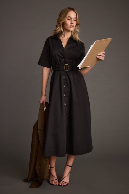 Black midi dress with elegant accents, a black fringe dress essential.