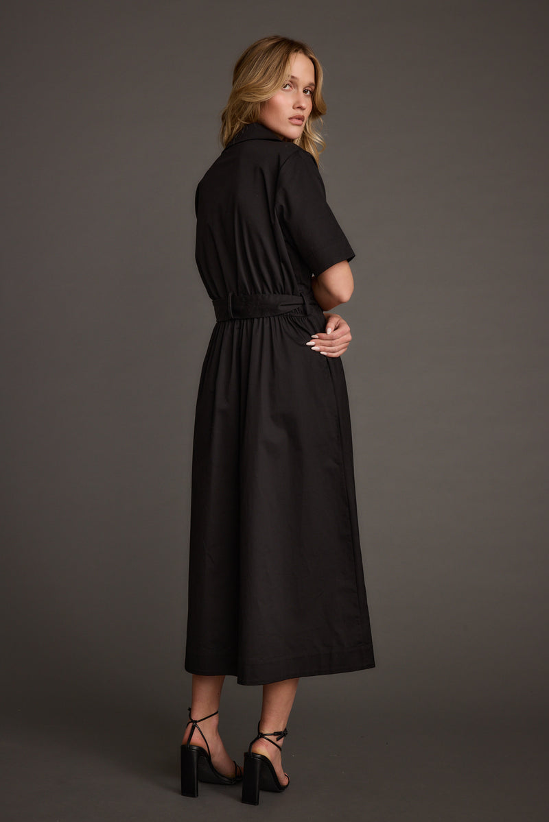 Back view of the black midi dress showing the silhouette and fit.