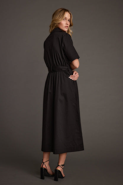 Back view of the black midi dress showing the silhouette and fit.