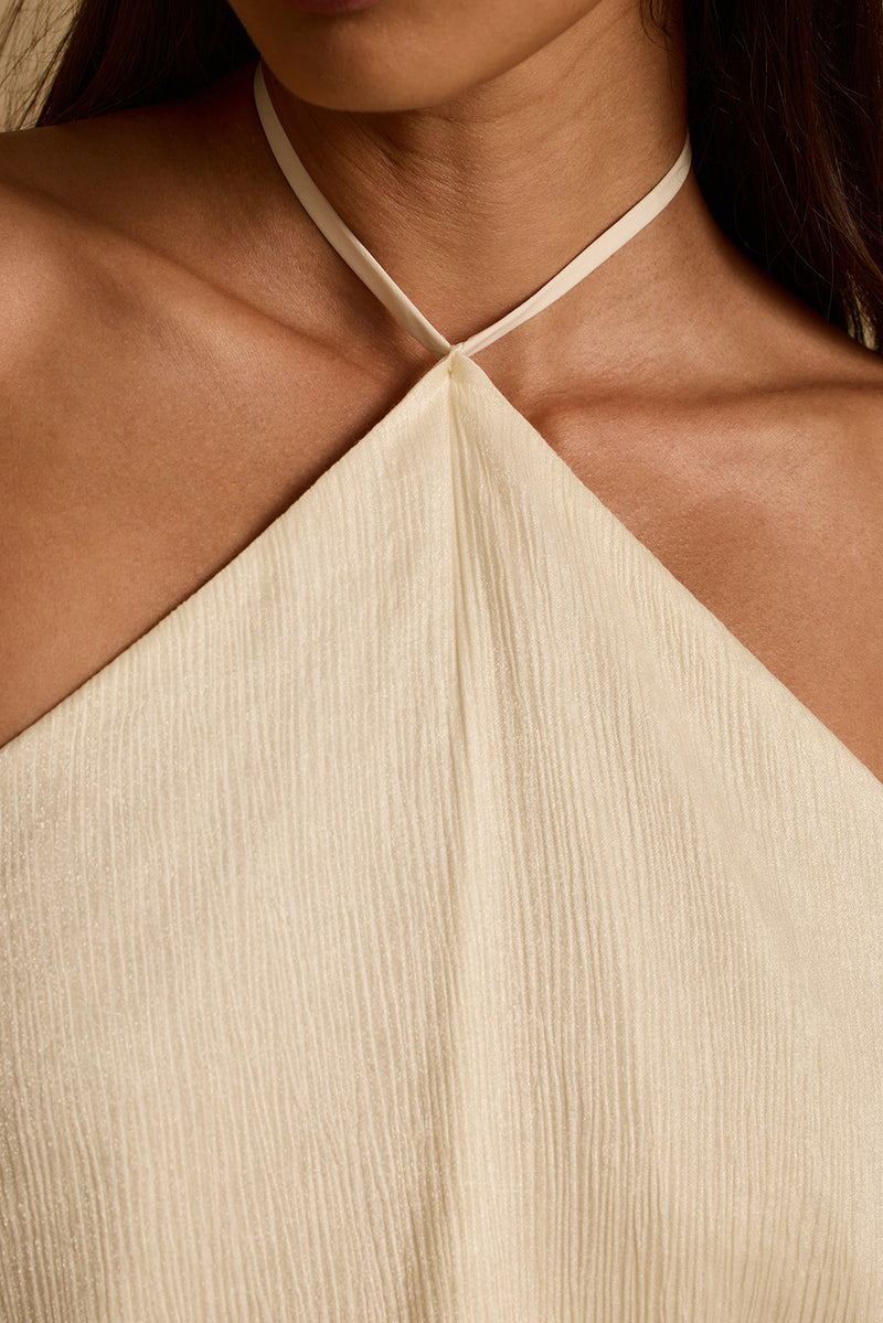 Close-up of cream halter neckline with shimmer texture on the Lennox resort mini dress.
