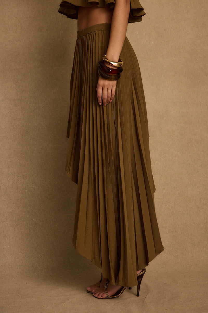 Full-length view of the olive midi skirt showing the drape and movement.
