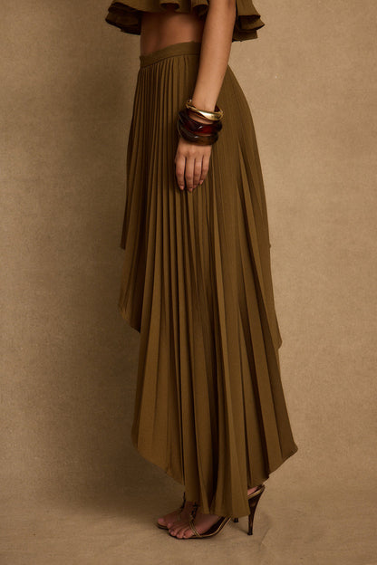Full-length view of the olive midi skirt showing the drape and movement.
