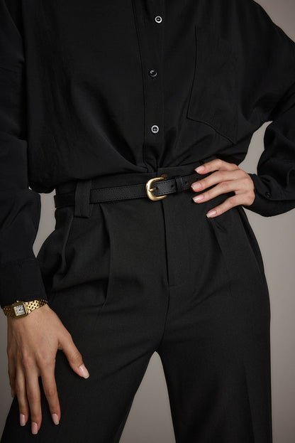 Gold leather belt with refined detailing and a flattering silhouette.