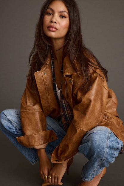 Cognac faux leather and leather oversized jacket with refined accents, a brown oversized leather jacket essential.