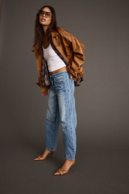 Full-length view of the cognac jacket showing the drape and movement.