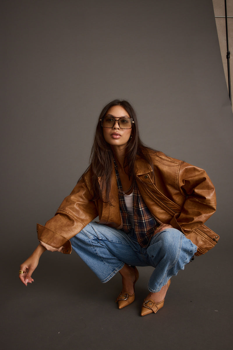 London Calling Cognac Oversized Faux Leather Jacket paired with complementary accessories for a polished look.