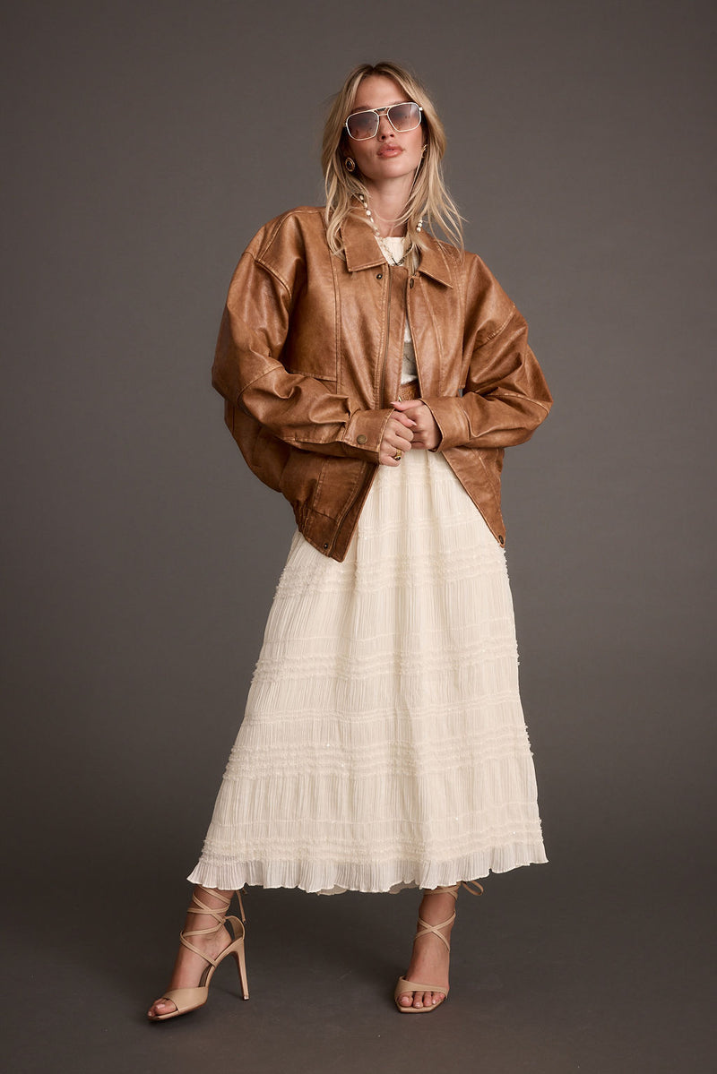 Detail shot of the London Calling Cognac Oversized Faux Leather Jacket highlighting the oversized elements.