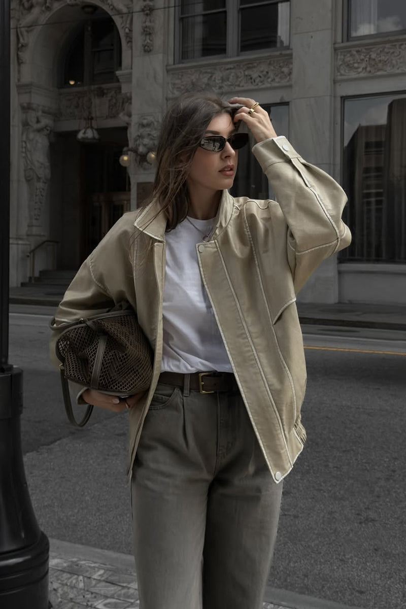 Faux leather and leather oversized jacket with accents and a flattering silhouette.