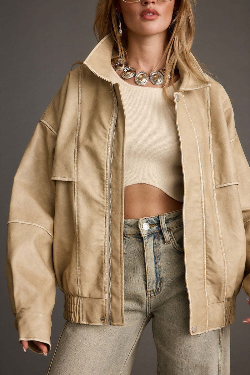 Close-up of the London Calling Light Taupe Oversized Faux Leather Jacket showcasing the faux leather texture and craftsmanship.