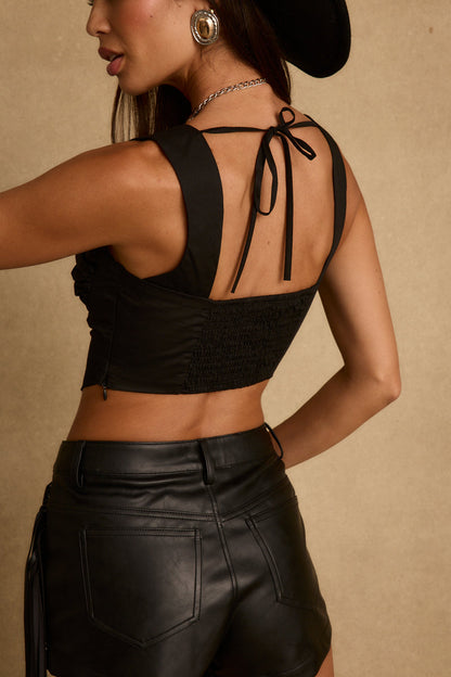 Back view of the black corset top showing the silhouette and fit.