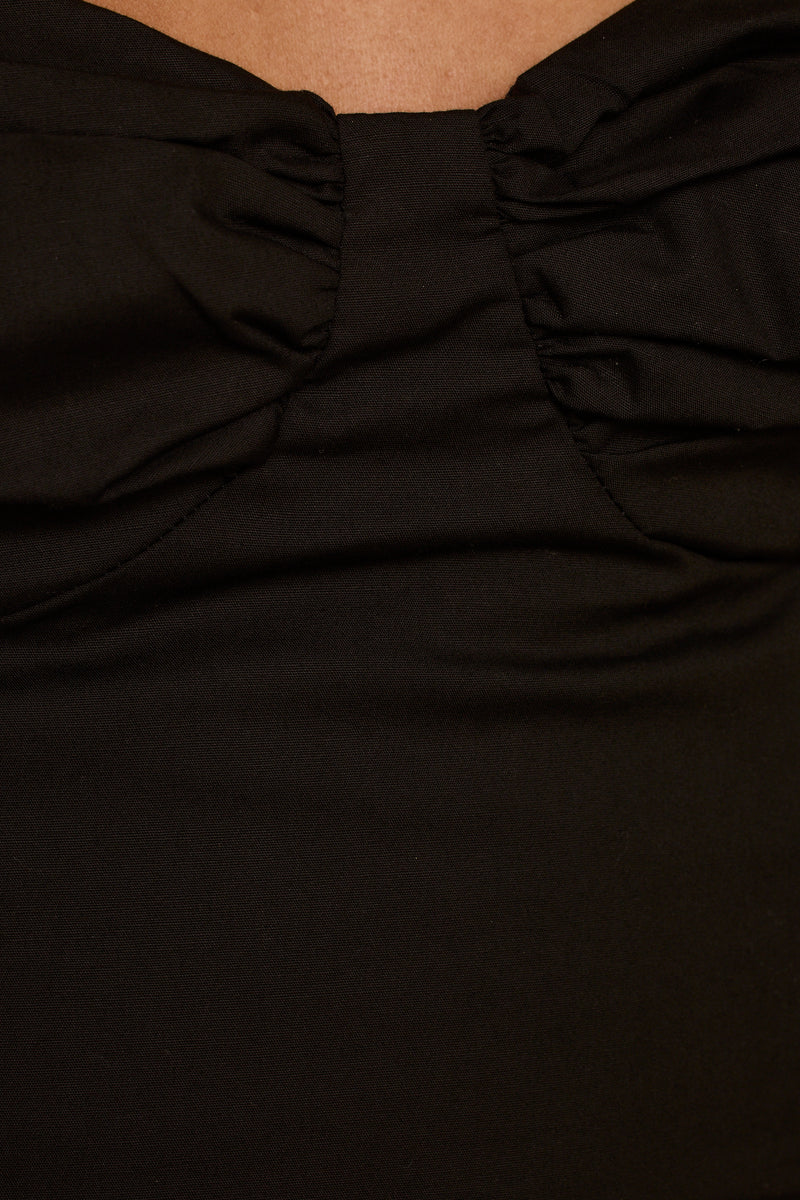 Lorelei Black Corset Top paired with complementary accessories for a polished look.