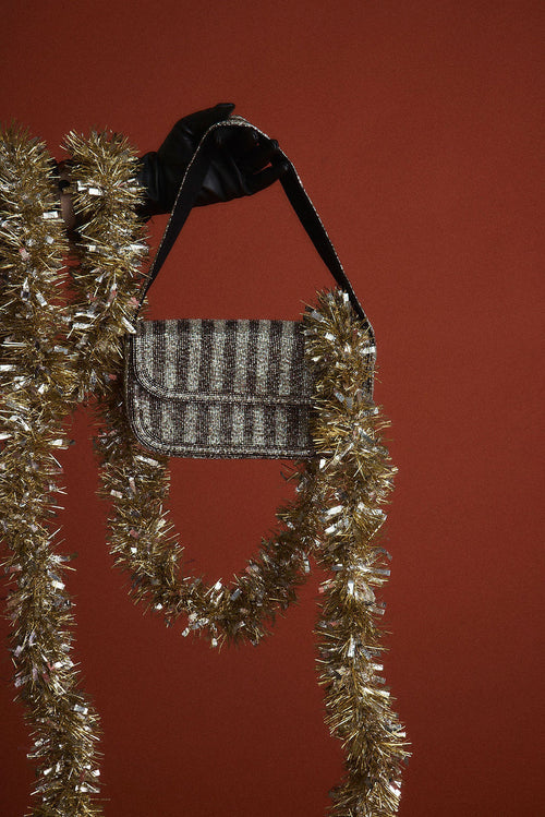 Black bag with refined detailing and a flattering silhouette.