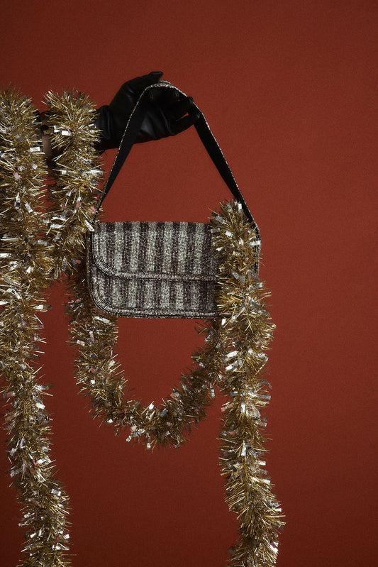 Black bag with refined detailing and a flattering silhouette.